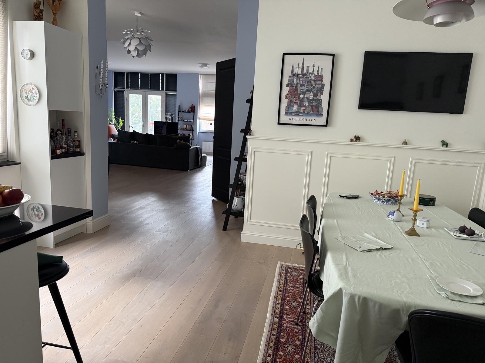 Dining area and Samsung The Frame TV, looking towards the living room